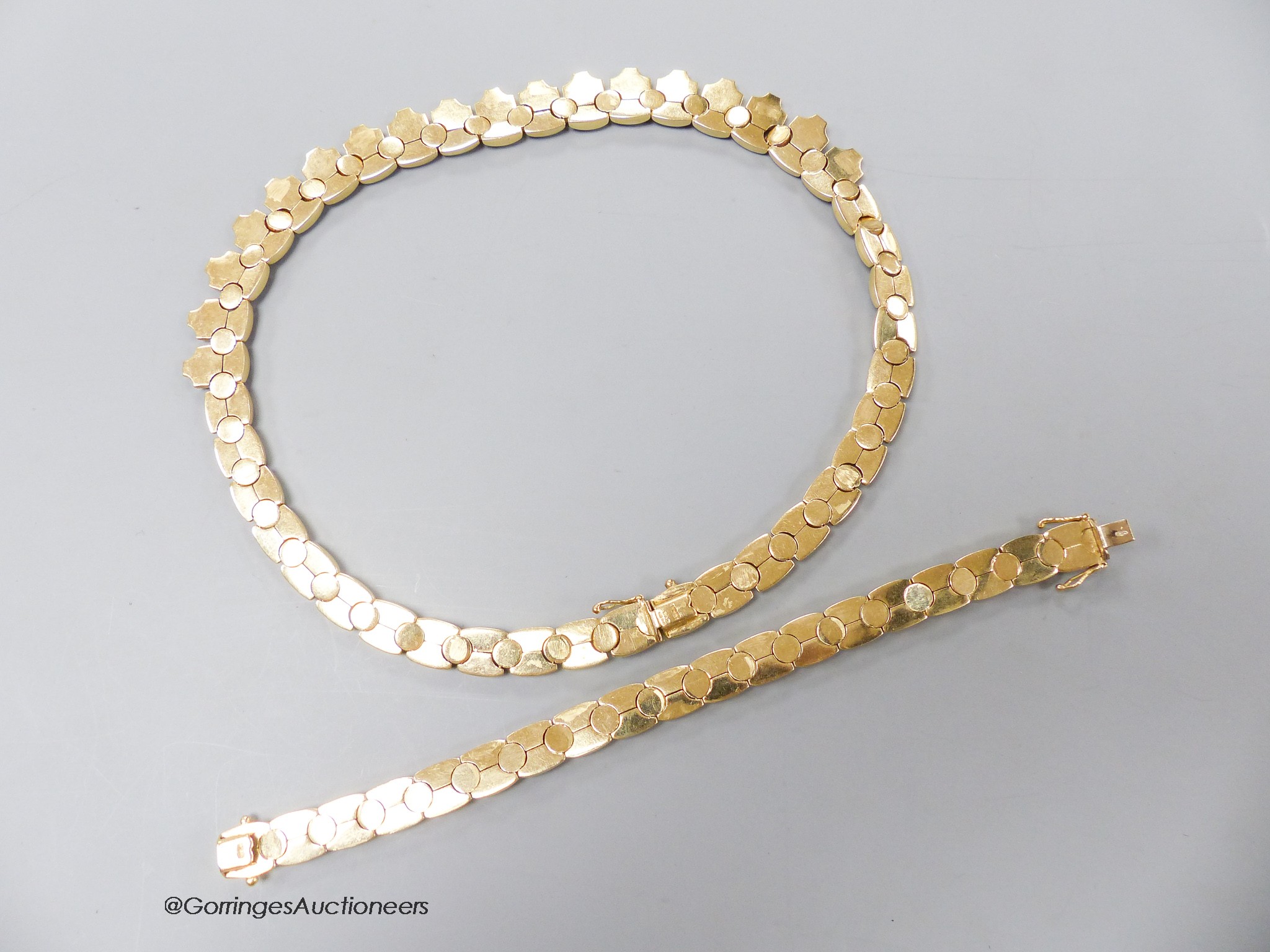 A modern 9ct gold necklace, 44cm and matching bracelet, 18cm